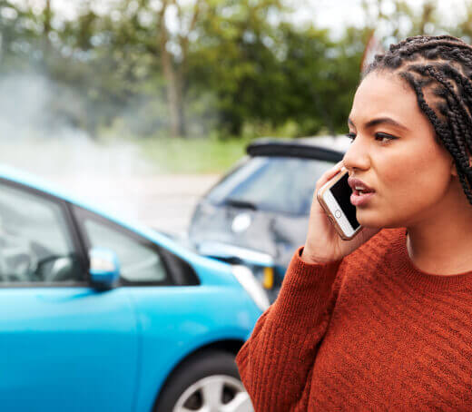 Woman calling agent after a car accident