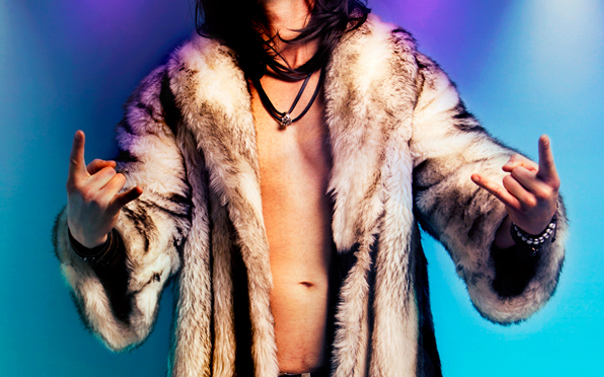 shirtless man wearing fur coat