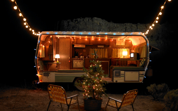 camping area with trailer and LED christmas lights 