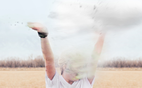 girl throwing baby powder in the air