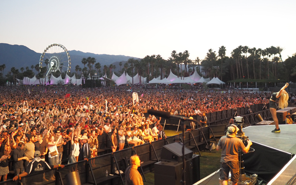 musician cheering crowd on at Coachella