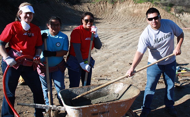 mercury employees pouring concrete