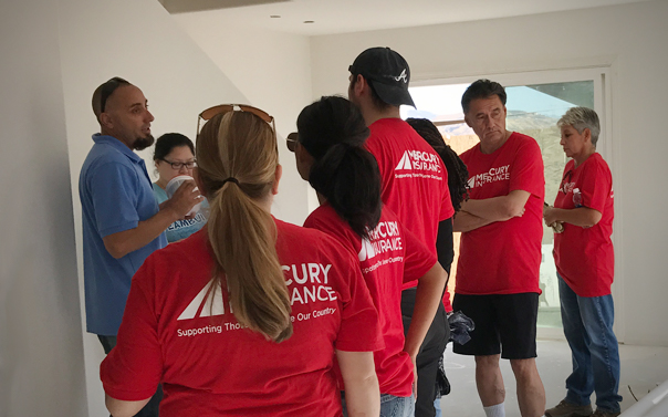 mercury employees staning in newly built house