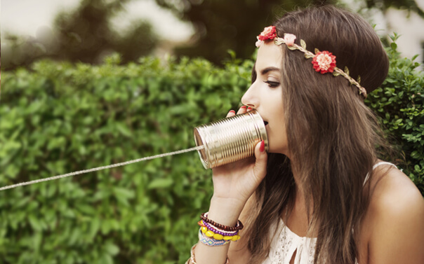 woman using tin can phone