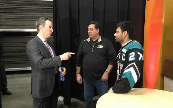 ducks fan talking to Scott Neidermayer at hockey hall of fame