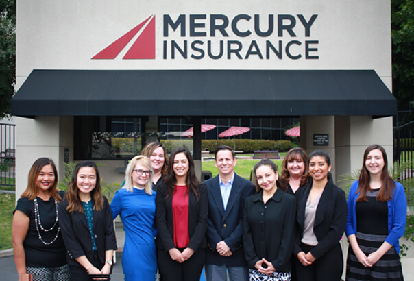 Mercury executives standing in front of a Mercury office