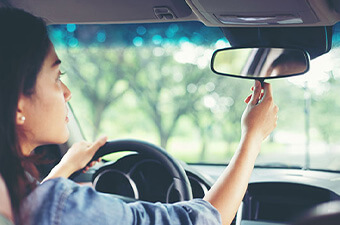 Teen Driver Checking Mirrors