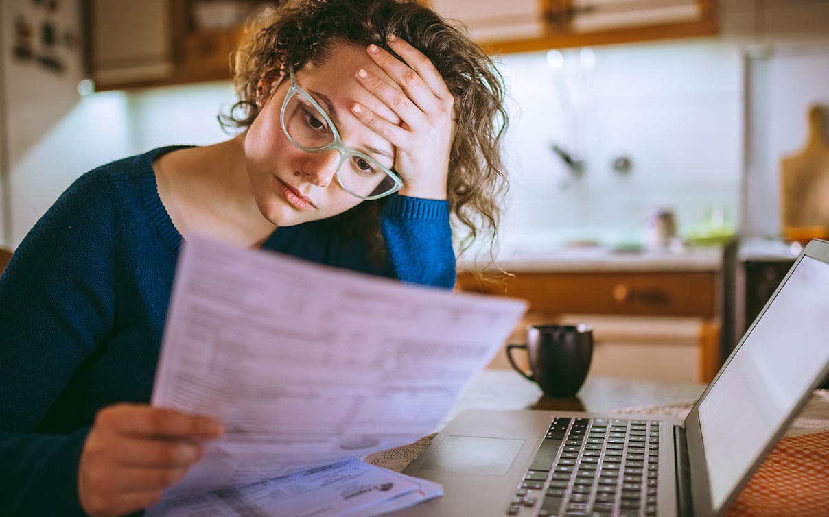 woman reviewing policy paperwork