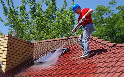 Man cleaning roof