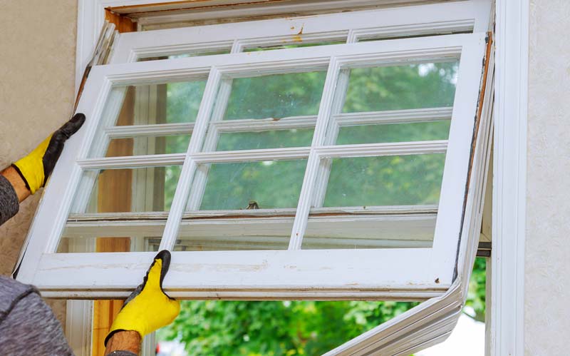 Person installing house windows