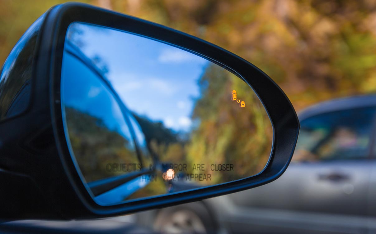 Car passenger sideview mirror