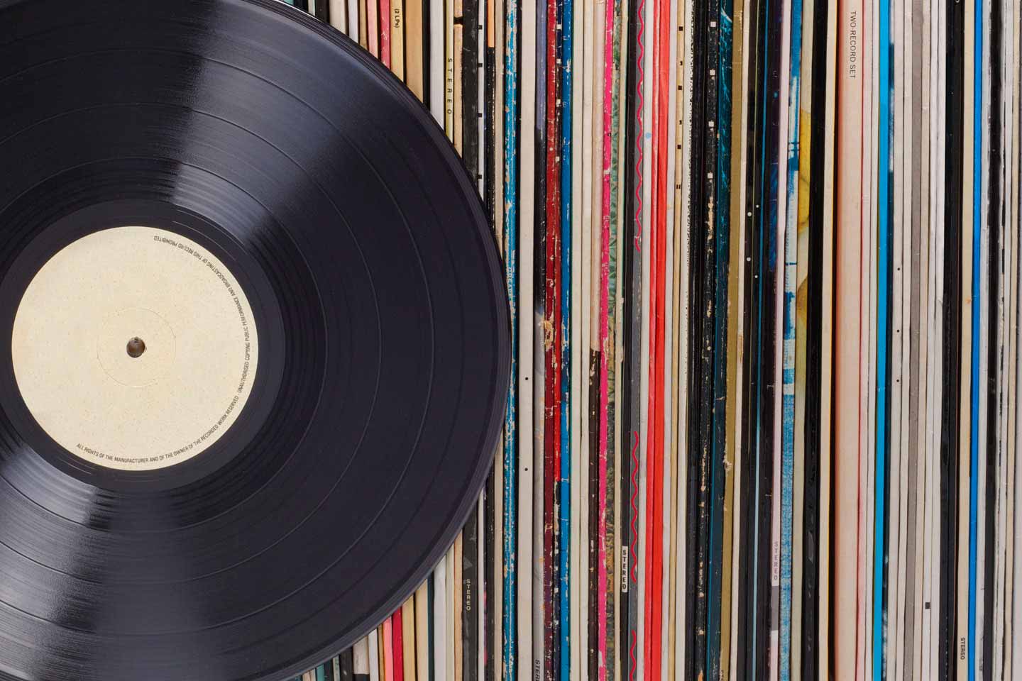 Record placed in front of a vinyl collection