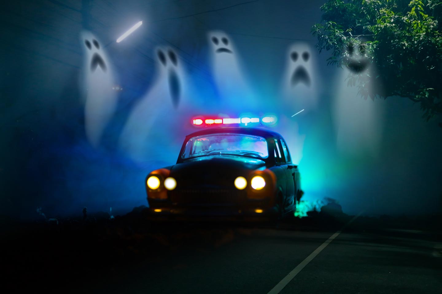 Vehicle with colorful lights driving at night surrounded by silly ghosts