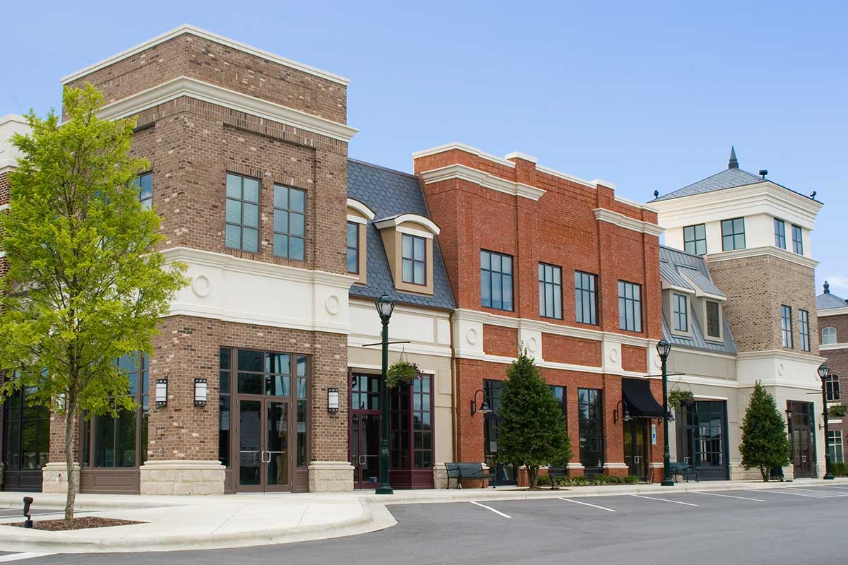 Commercial building featuring shops along strip mall