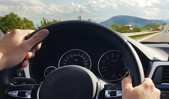 Driving a car on the high-way.