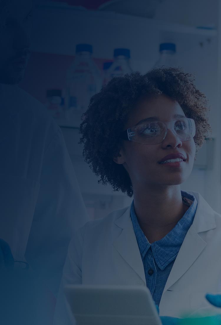 Three scientists in a lab finding a solution to a problem.