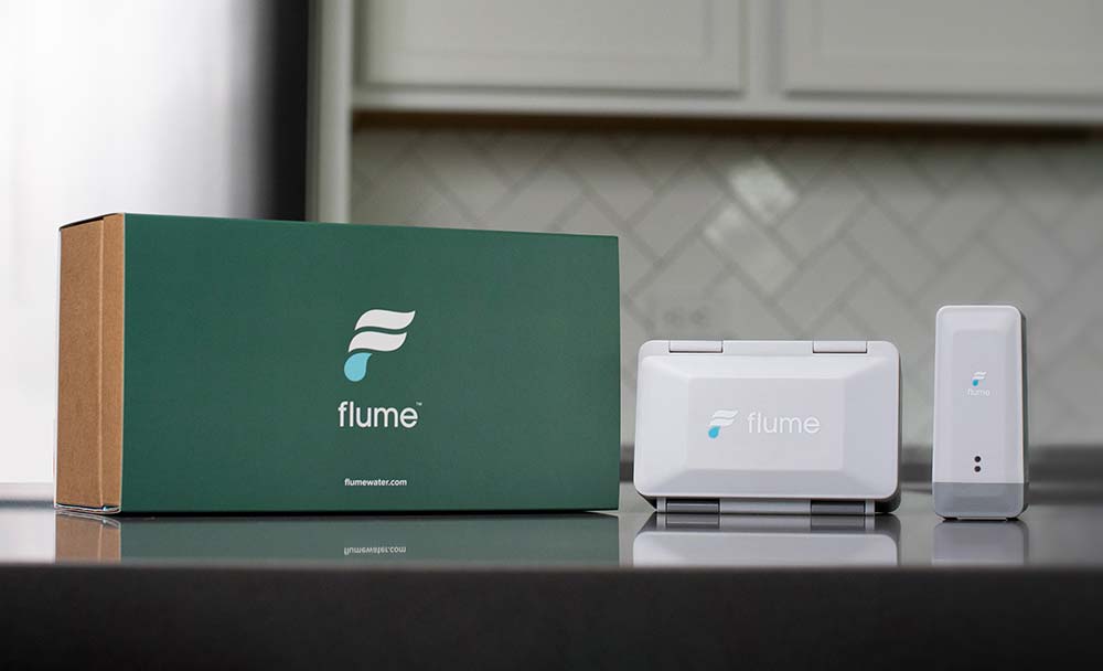 Flume devices sitting on kitchen countertop
