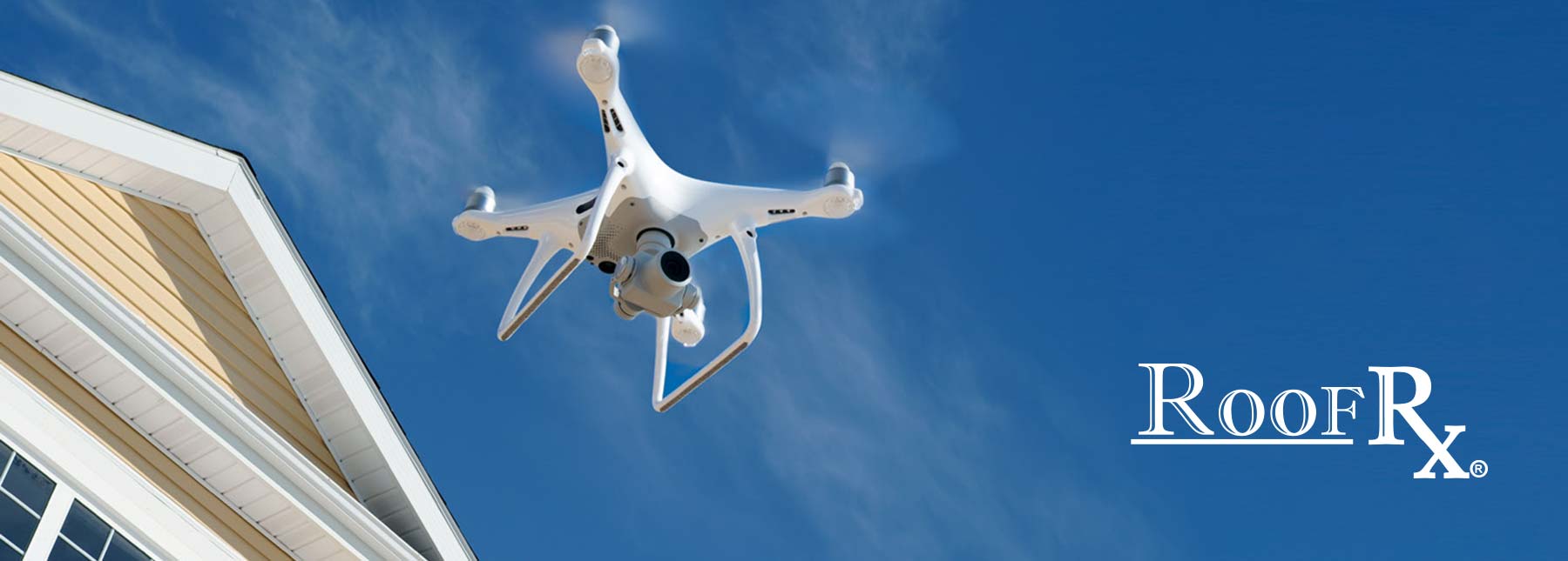 Drone flying in front of house to begin roof inspection