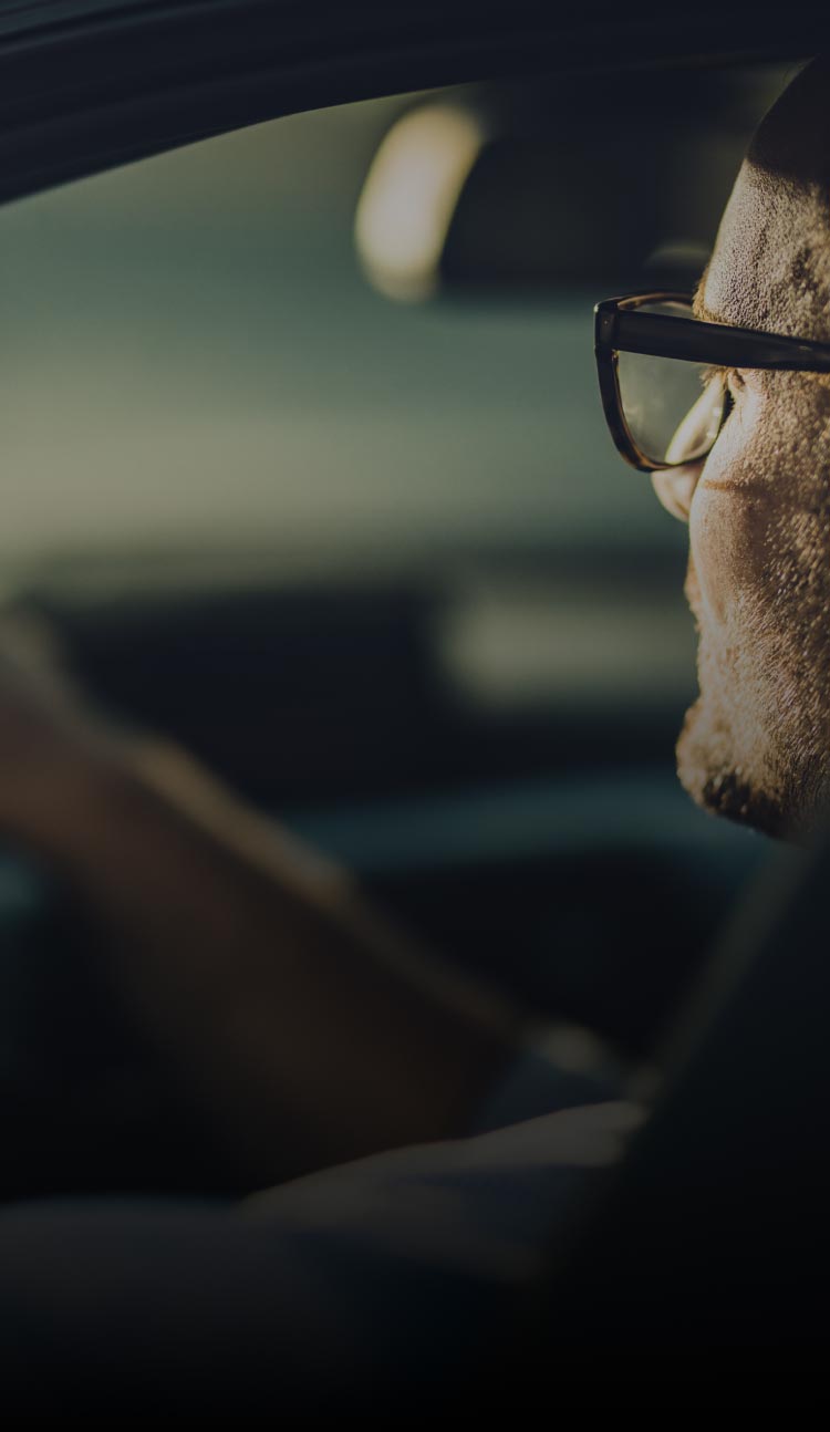 Man in car looking at road